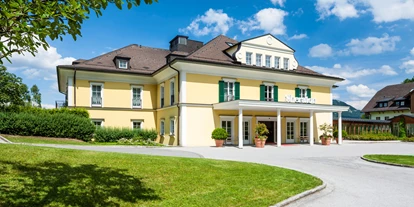 Winterhochzeit - e-Ladestation - Schwöll - Hotelansicht - Sheraton Fuschlsee-Salzburg Hotel Jagdhof