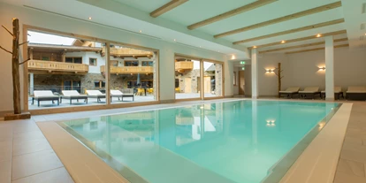 Winterhochzeit - Tirol - Wellnessbereich mit Innenpool, Fitnessraum und Saunabereich - PURE Resort Pitztal